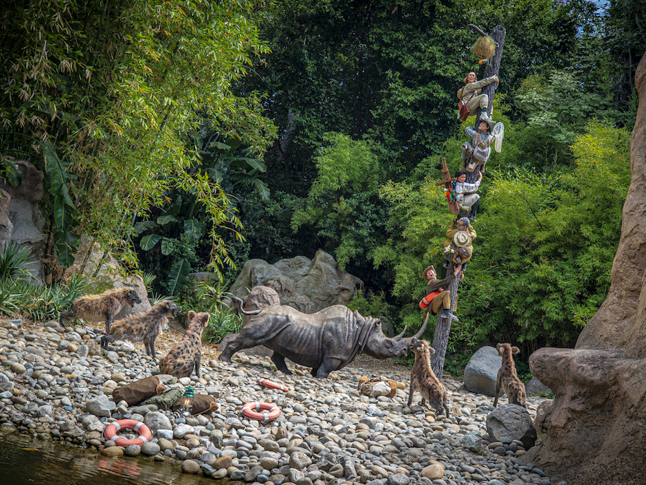 caption: Disneyland's updated Jungle Cruise ride features tourists of various ethnic backgrounds getting chased by wildlife.