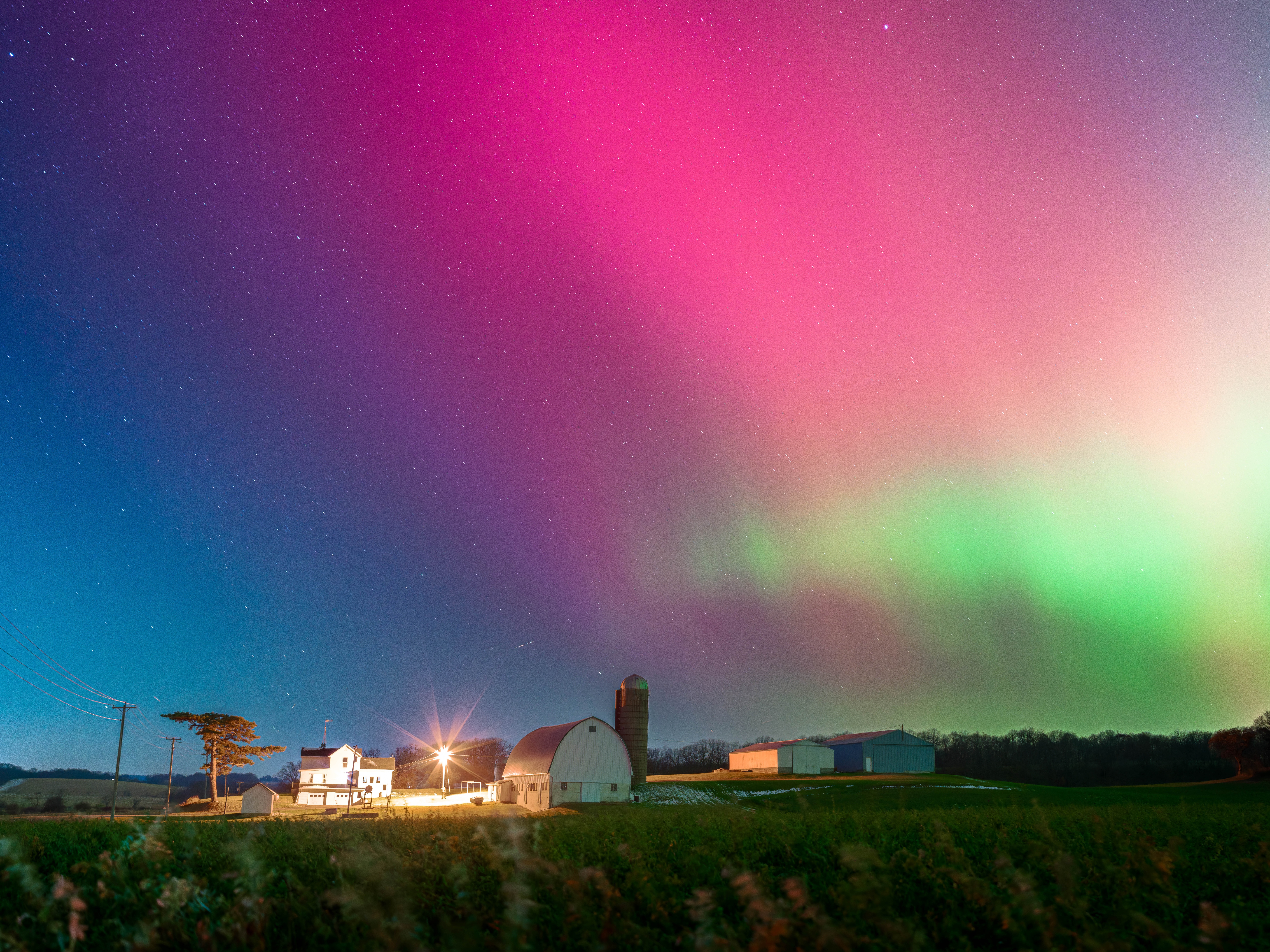 caption: The aurora borealis lit up the night sky over Monroe, Wis., on Tuesday night. The northern lights were visible as far south as Alabama and Florida