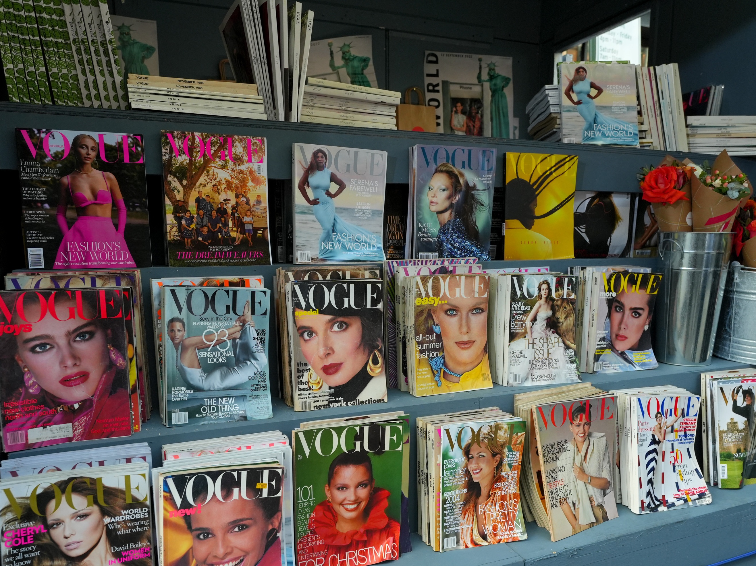 caption: In <em>Empire of the Elite,</em> Michael Grynbaum tracks Condé Nast's decades of cultural dominance up through its decline today. Above, Vogue magazines at a newsstand during VOGUE World: New York in 2022.
