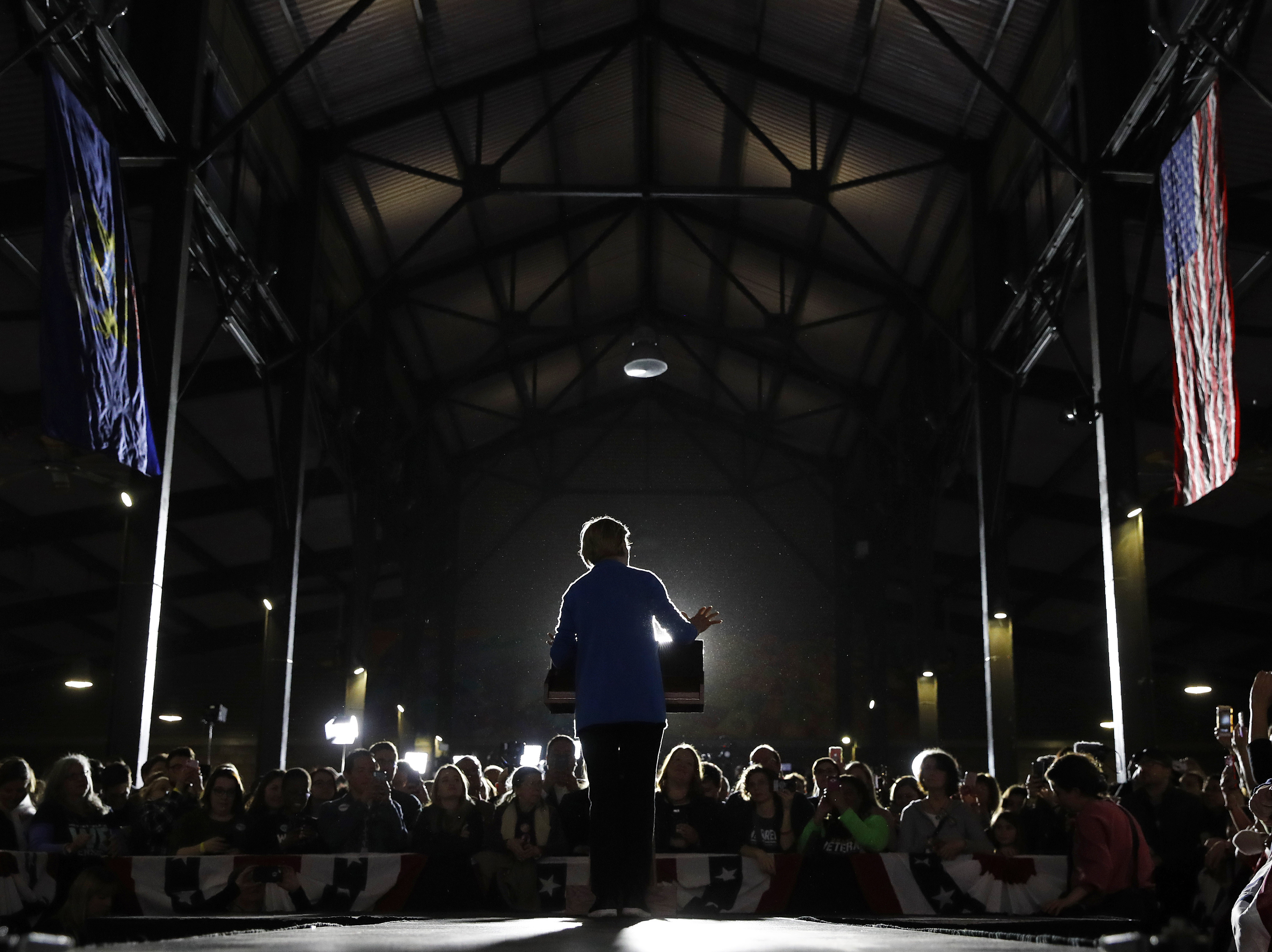 caption: Democratic presidential candidate Sen. Elizabeth Warren, D-Mass., speaks at a rally Tuesday in Detroit.