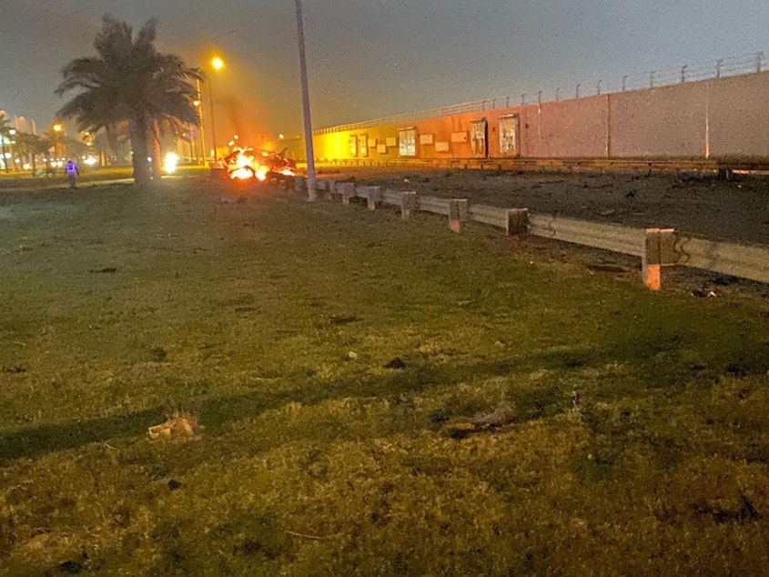 caption: The remains of a burning vehicle at the Baghdad International Airport following an airstrike early Friday, Jan. 3, 2020. The Pentagon said Thursday that the U.S. military killed Gen. Qassem Soleimani, the head of Iran's elite Quds Force, at the direction of President Donald Trump.