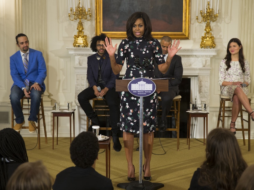 caption: First lady Michelle Obama speaks during an event with the cast of the Broadway play "Hamilton" at the White House in 2016.