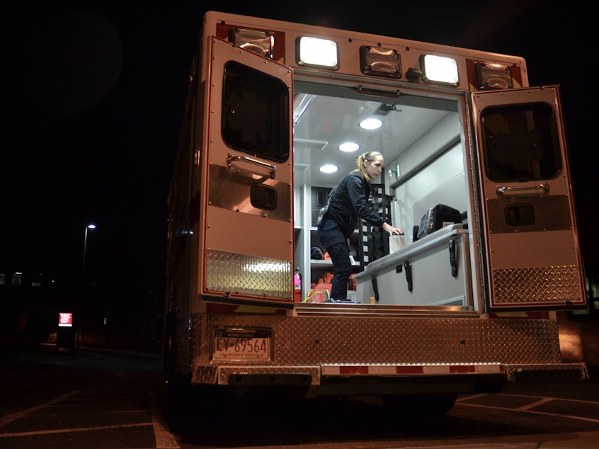 caption: Emergency medical technician Justine Berry with Susquehanna Township EMS in Harrisburg, Pa., cleans an ambulance with antimicrobial wipes after a patient has been removed. EMS directors say more cleaning supplies and protective equipment will be vital if the coronavirus becomes widespread.