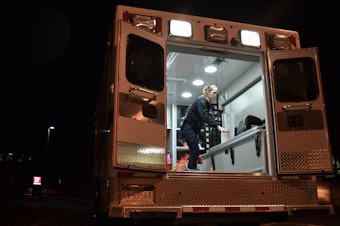 caption: Emergency medical technician Justine Berry with Susquehanna Township EMS in Harrisburg, Pa., cleans an ambulance with antimicrobial wipes after a patient has been removed. EMS directors say more cleaning supplies and protective equipment will be vital if the coronavirus becomes widespread.