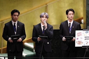 caption: BTS sang (on a video viewed by more than 1 million). And they spoke. Left to right: Taehyung/V, Suga and Jin of the South Korean boy band at the launch of the U.N. General Assembly's 76th session on Sept. 20.