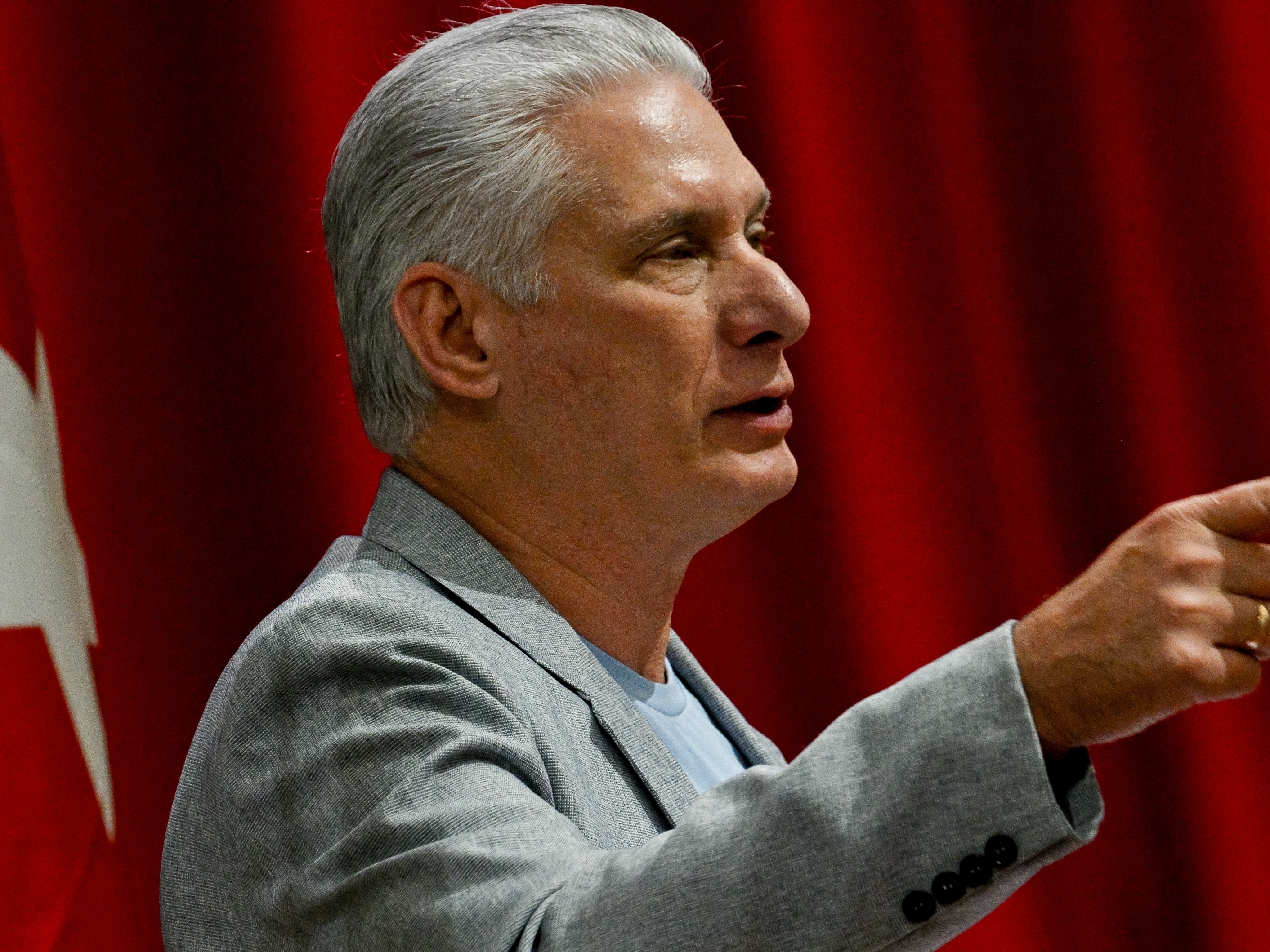 caption: Cuban President Miguel Diaz-Canel delivers a welcome speech to participants of the "Nuestra America," or Our America Convoy at the Convention Palace in Havana, Cuba, Friday, March 20, 2026.