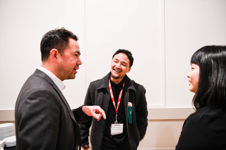 caption: Joshua Wisnubroto (center) is photographed in January participating in an event part of the Washington Education Association's teacher residency.
