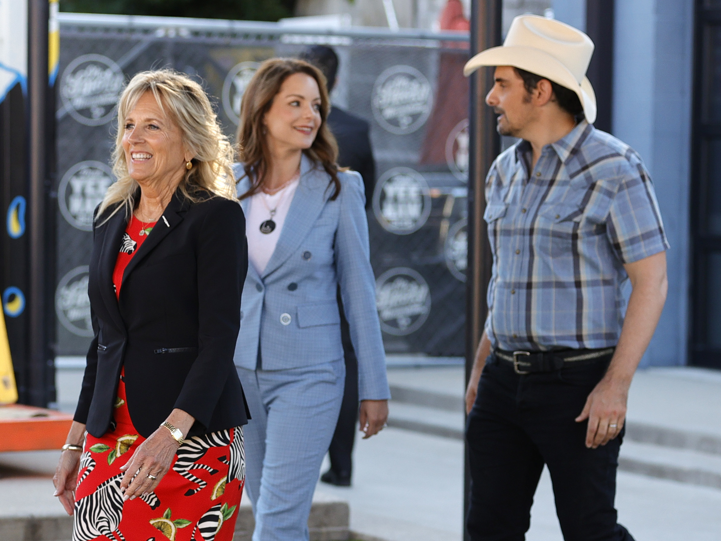caption: First lady Jill Biden tours a vaccination site in Nashville with country star Brad Paisley and his wife Kimberly Williams-Paisley.