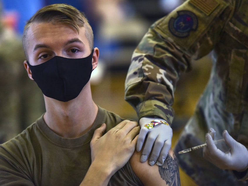 caption: The first COVID-19 mass vaccination on Joint Base Pearl Harbor-Hickam in Hawaii is held on Feb. 9, 2021. The Army says it will "immediately begin separating Soldiers from the service" who refuse to be vaccinated.