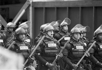 caption: Police used tear gas to clear the streets of protesters during the WTO convention in Seattle on Nov. 29, 1999. 
