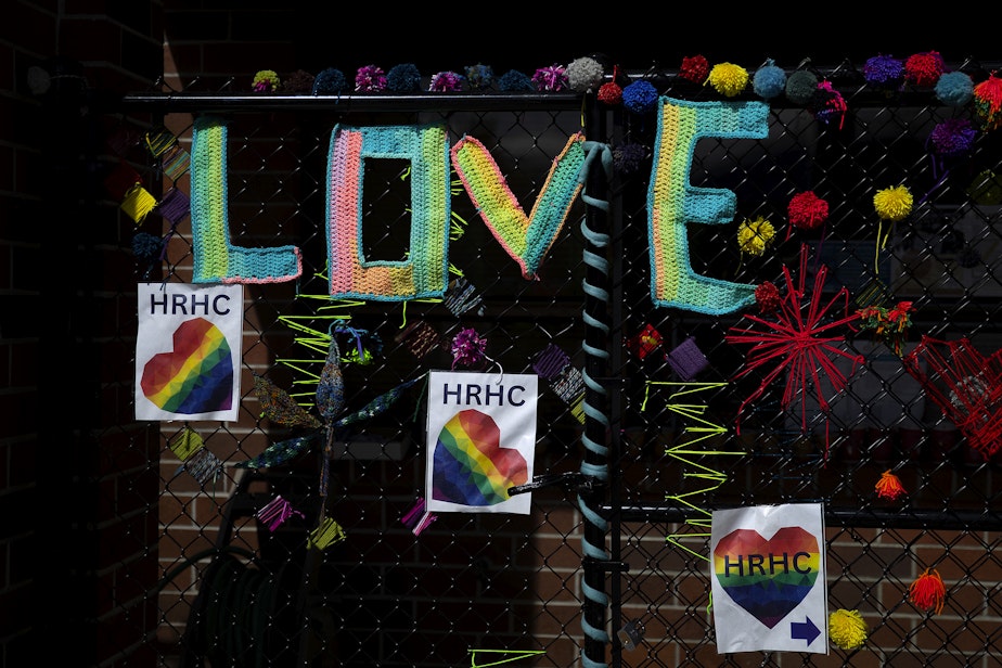caption: Crocheted letters spell ‘love’ on the fence outside of the harm reduction health center, a program of Clallam County Health and Human Services, on Tuesday, April 25, 2023, in Port Angeles.