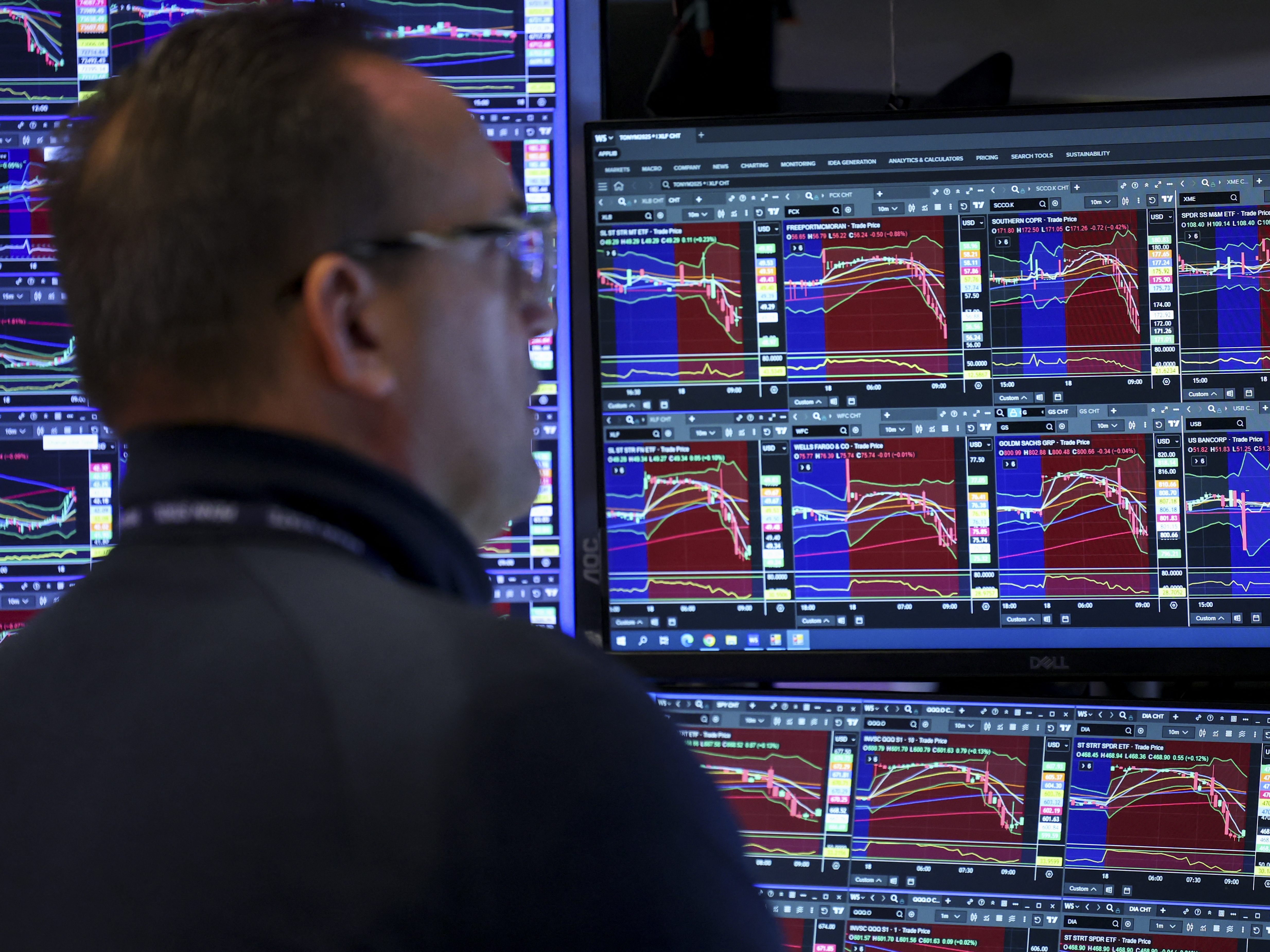 caption: A trader works on the floor of the New York Stock Exchange at the opening bell in New York on Wednesday.