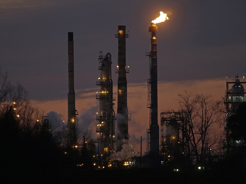 caption: New York's attorney general is suing Exxon Mobil, accusing the company of defrauding shareholders. Above, an Exxon refinery in St. Bernard Parish, La., is seen in 2015.