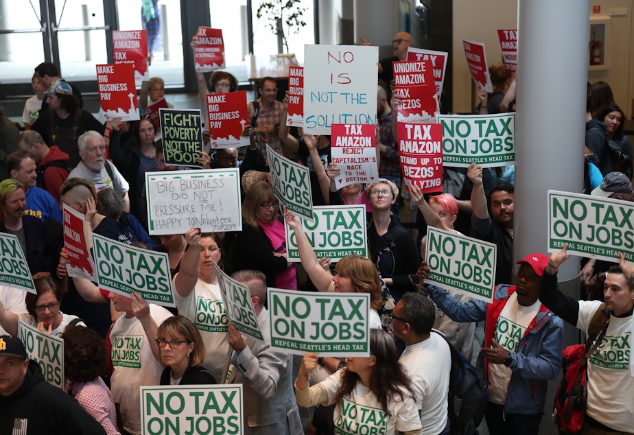 caption: Head tax opponents and supporters crowd Seattle City Hall on Tuesday, June 12, 2018.