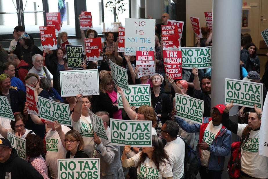 caption: Head tax opponents and supporters crowd Seattle City Hall on Tuesday, June 12, 2018.