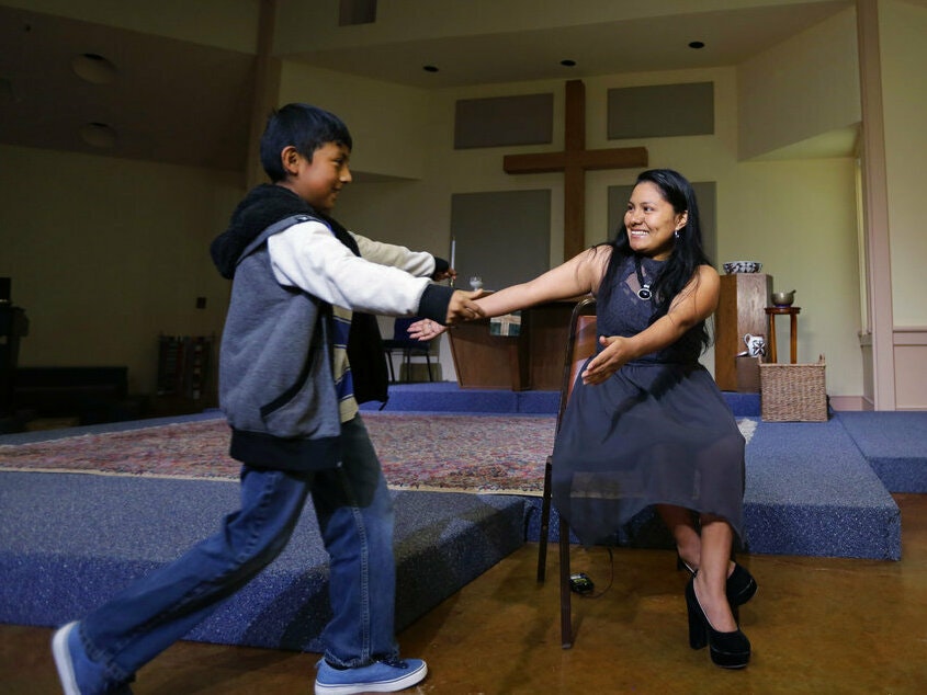 caption: Hilda Ramirez and her son, Ivan, in 2017 at St. Andrew's Presbyterian Church in Austin, Texas, where they have been living for close to eight years.