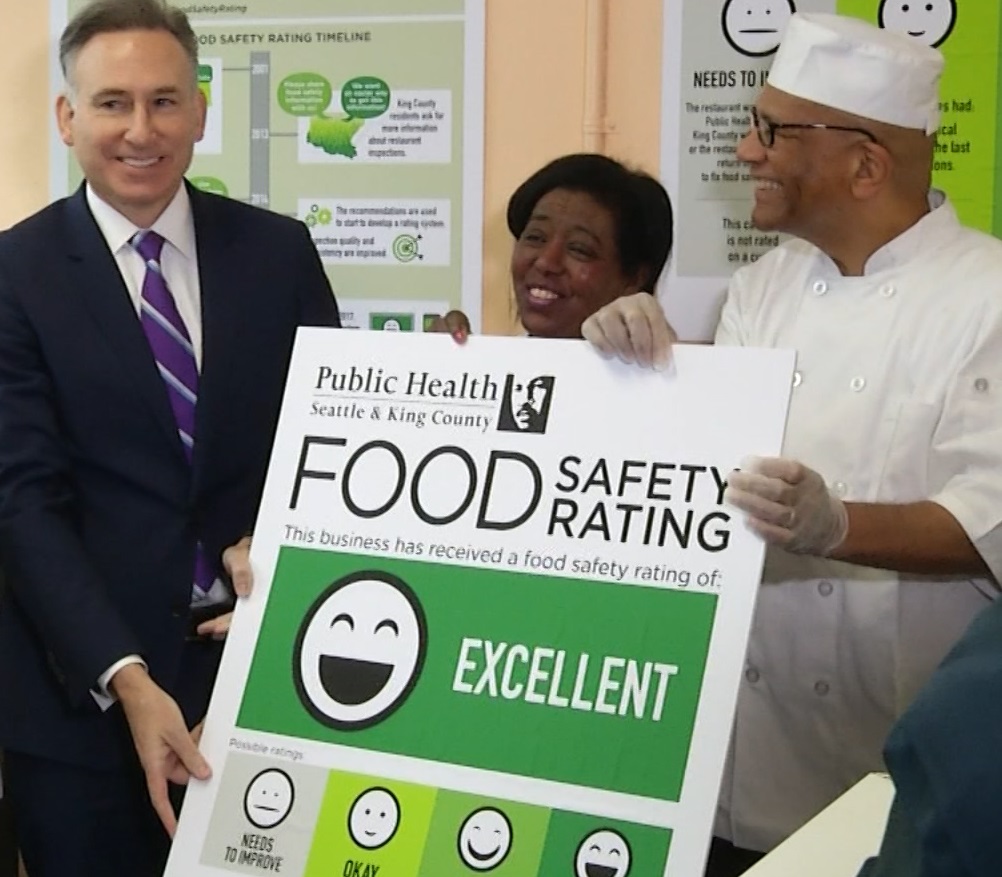 caption: King County executive Dow Constantine presents West Seattle Fish House with an 'excellent' food safety rating.