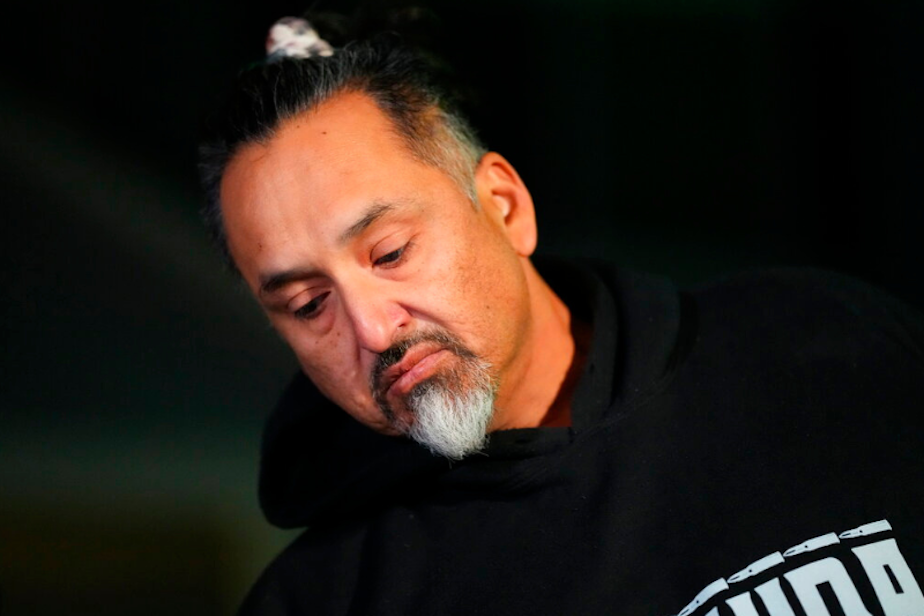 caption: Richard Fierro talks during a news conference outside his home about his efforts to subdue the gunman in Saturday's fatal shooting at Club Q, Monday, Nov. 21, 2022, in Colorado Springs, Colo. 