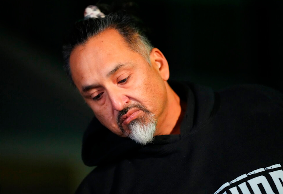 caption: Richard Fierro talks during a news conference outside his home about his efforts to subdue the gunman in Saturday's fatal shooting at Club Q, Monday, Nov. 21, 2022, in Colorado Springs, Colo. 