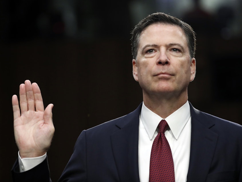 caption: Former FBI director James Comey is sworn in during a Senate Intelligence Committee hearing on Capitol Hill, in June 2017.