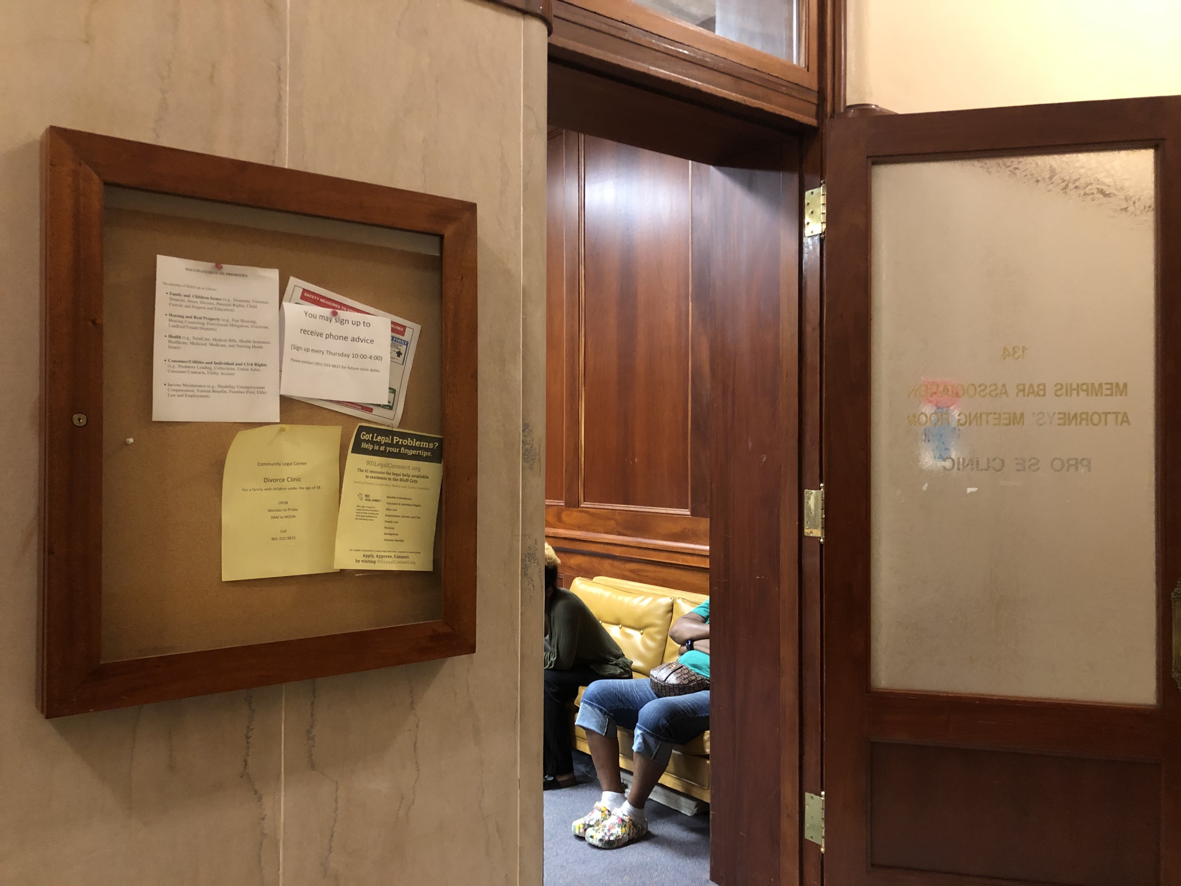 caption: Tenants facing eviction wait to speak with attorneys from Memphis Area Legal Services in Room 134 of the Shelby County General Sessions Court in Memphis, Tenn.
