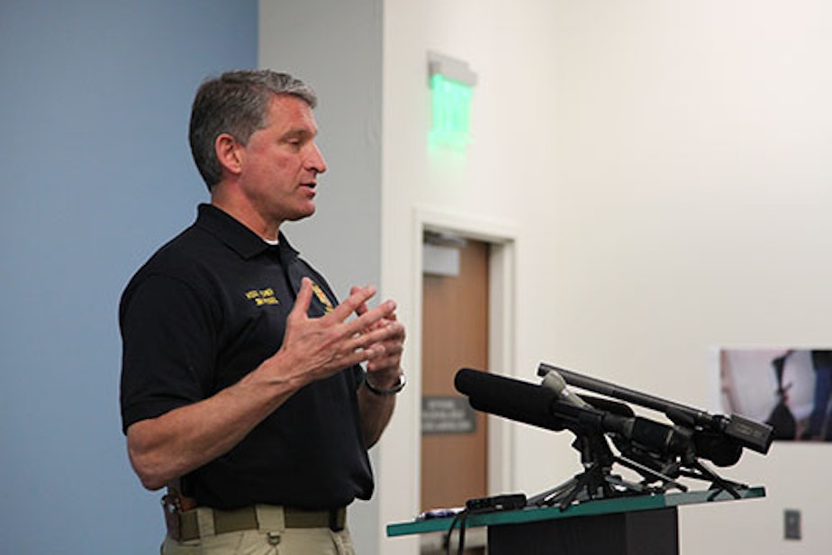 caption: Assistant Chief Jim Pugel speaking at a press conference on gun safety, April 18, 2012.