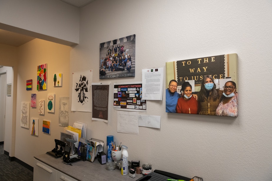caption: Artwork and photos line the halls at The Way to Justice on Thursday, May 1, 2025 in Spokane, Wash.