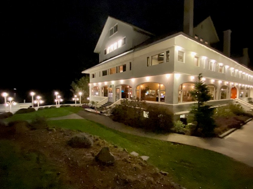 caption: The Moran Mansion at Rosario Resort and Spa at night is a festive oasis on Orcas Island, Washington. 