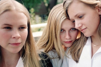 caption: Leslie Hayman, Kirsten Dunst, A.J. Cook and Chelse Swain as the enigmatic Lisbon sisters in Sofia Coppola's <em>The Virgin Suicides</em>.