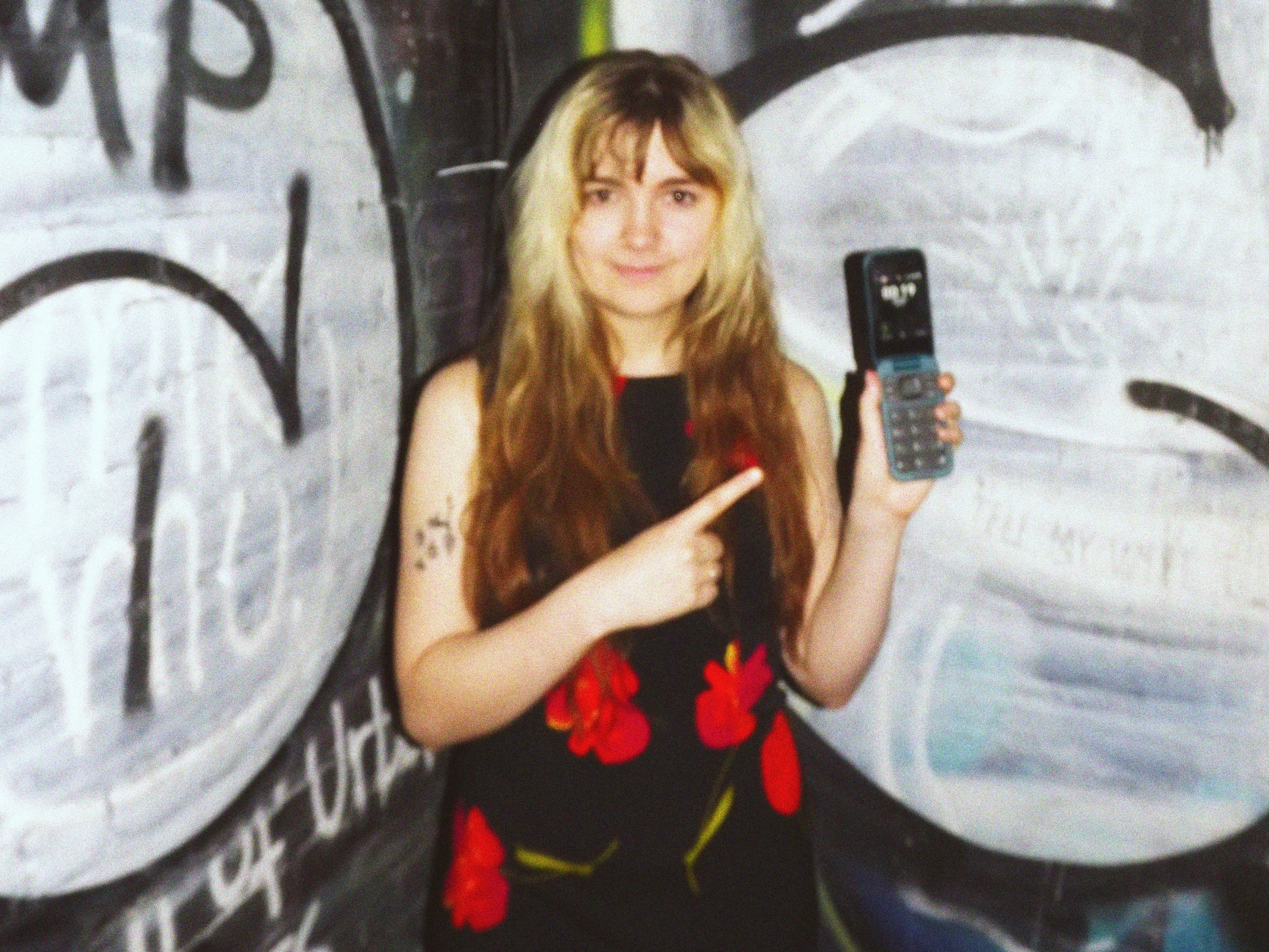caption: August Lamm two years into her dumbphone journey in New York, July 2024.