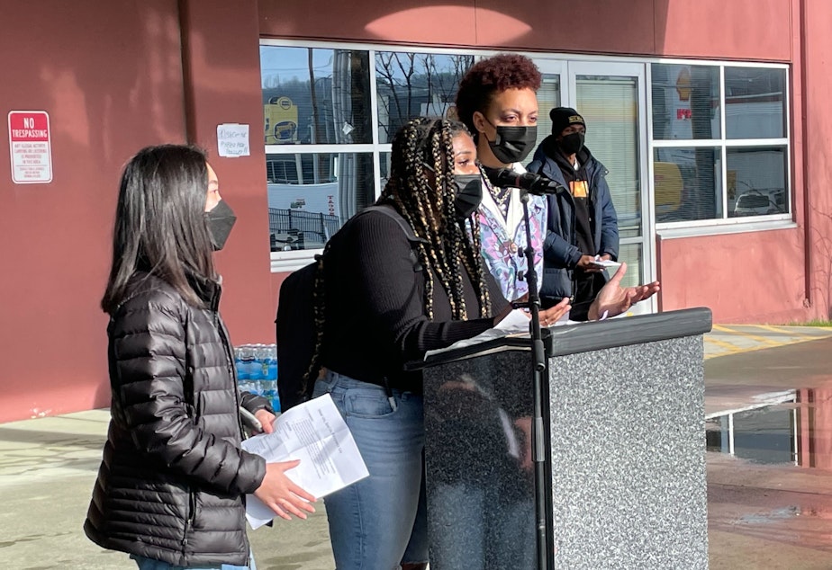 caption: Nya Spivey of Cleveland High School addresses the crowd outside the John Stanford Center for Educational Excellence.