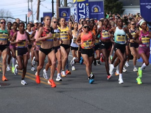 caption: Women runners at the start of the 2024 Boston Marathon. Women couldn't officially compete in this race until 1972.