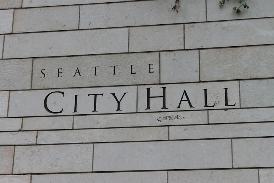 caption: The sign at Seattle City Hall. 