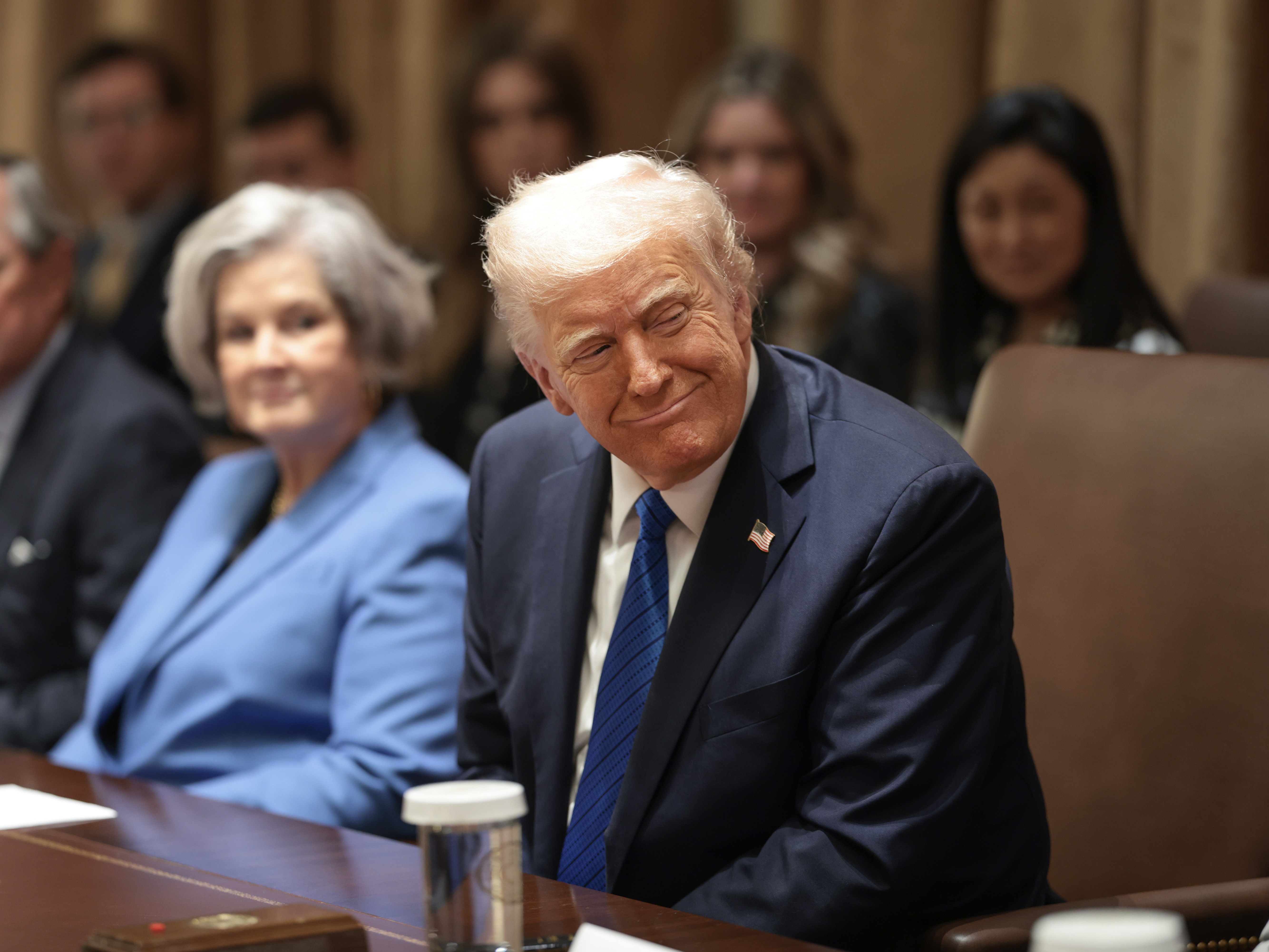 caption: President Trump meets with a group of his ambassadors in the Cabinet Room of the White House on March 25.