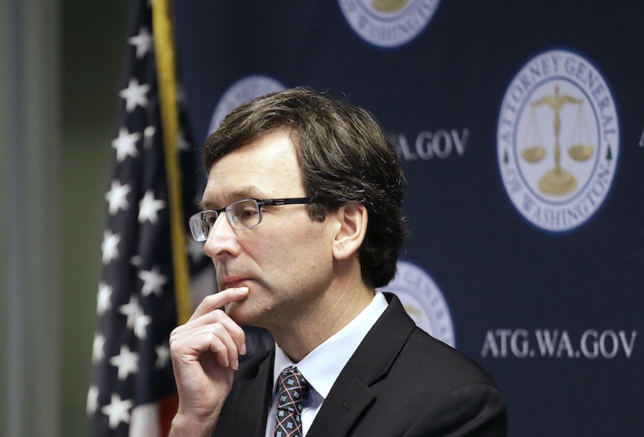caption: Washington state Attorney General Bob Ferguson looks on during a news conference in Seattle on Dec. 17, 2019.