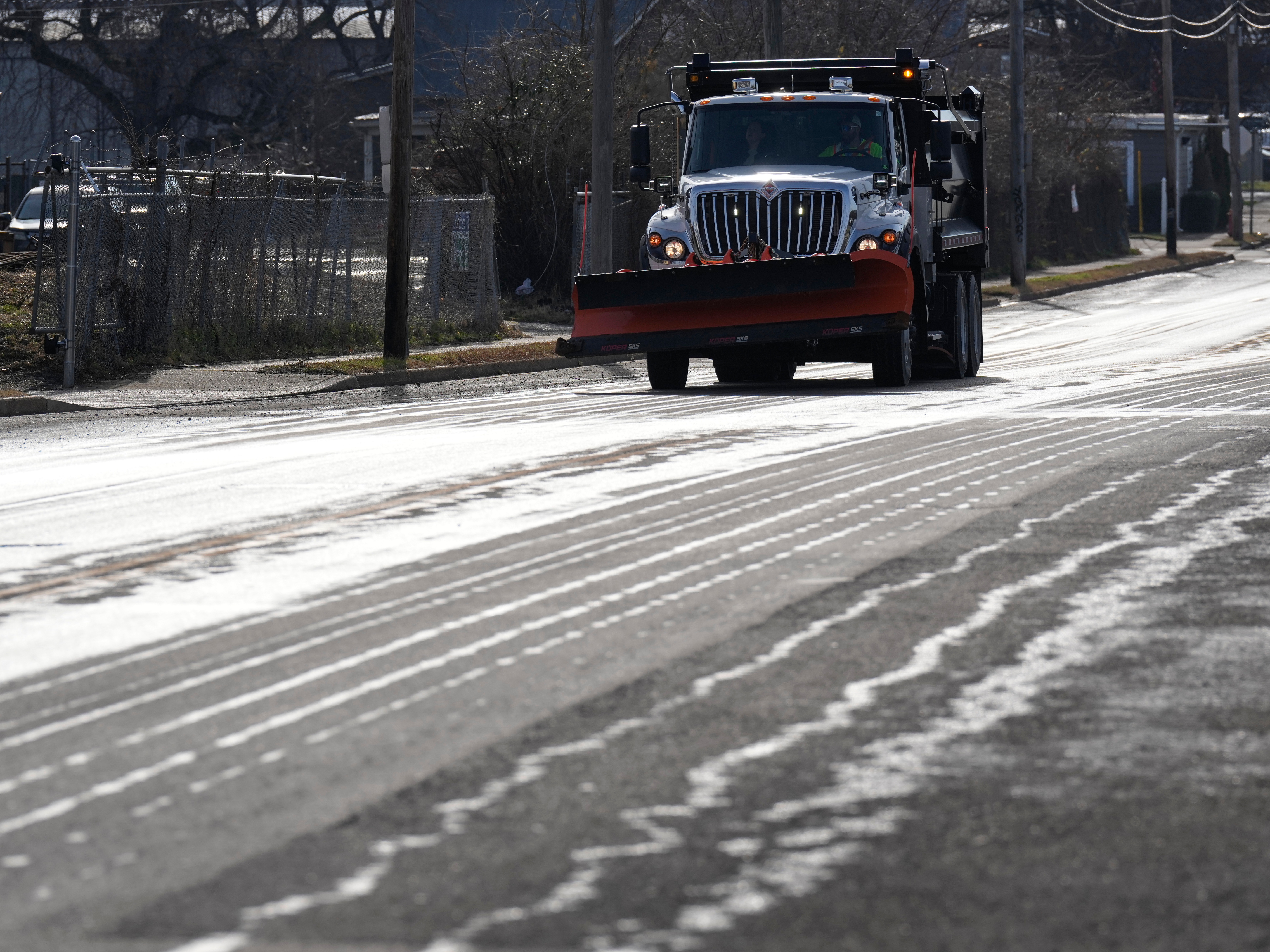 caption: A Nashville Department of Transportation truck applies salt brine to a roadway on Thursday in Nashville, Tenn., ahead of a winter storm expected to hit the central and eastern United States over the weekend.