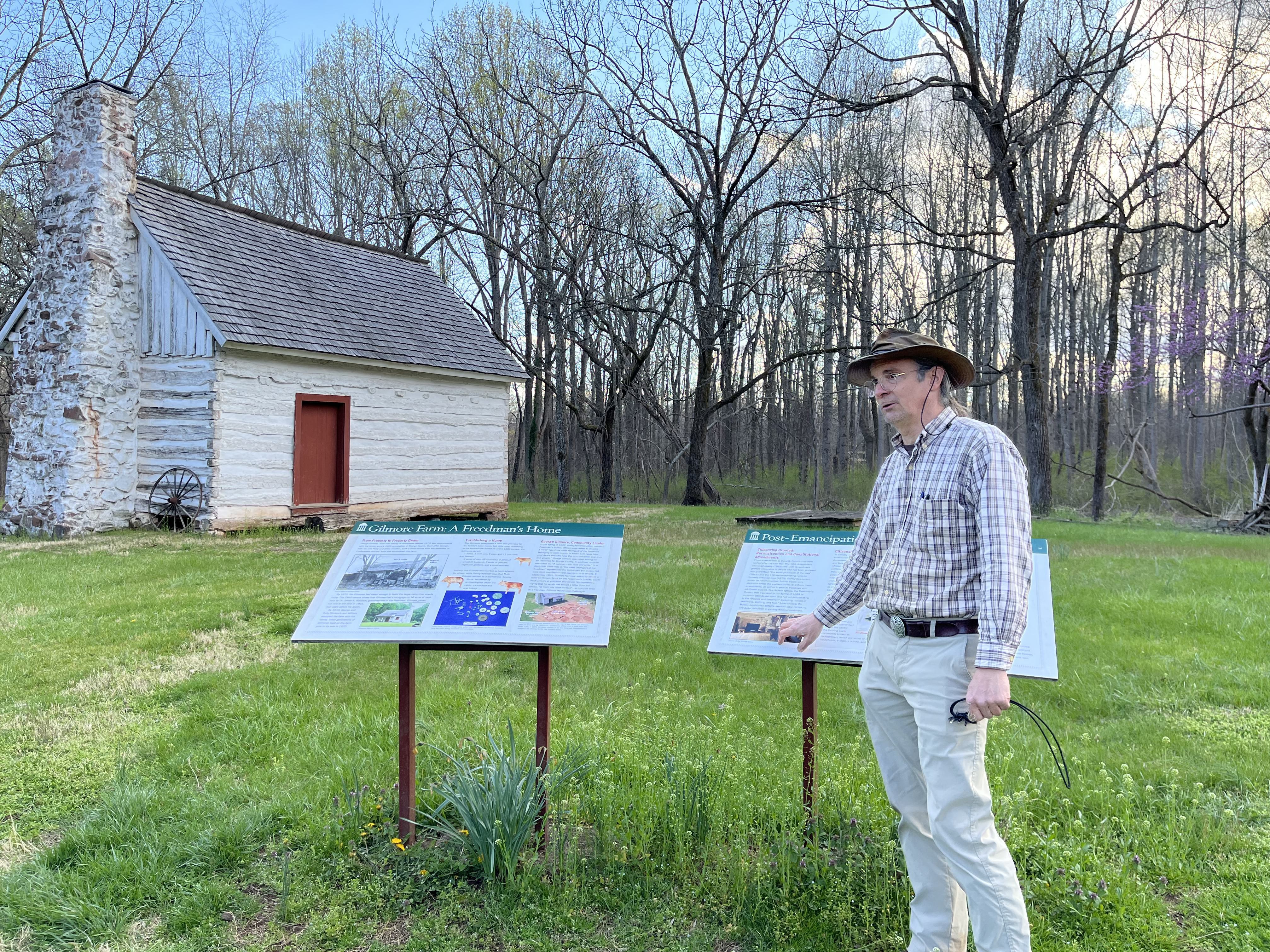 caption: Matt Reeves, a former employee of Montpelier who was fired this week, pictured outside of the historic Gilmore cabin at Montpelier.
