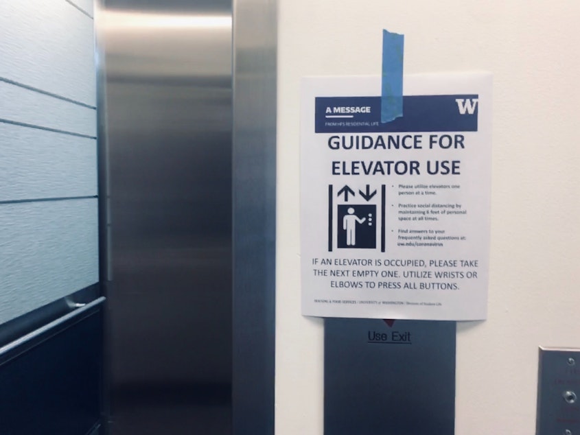 caption: Students and families are advised to take the elevator one at a time at Mercer Court at UW Seattle Campus. March 19, 2020. 