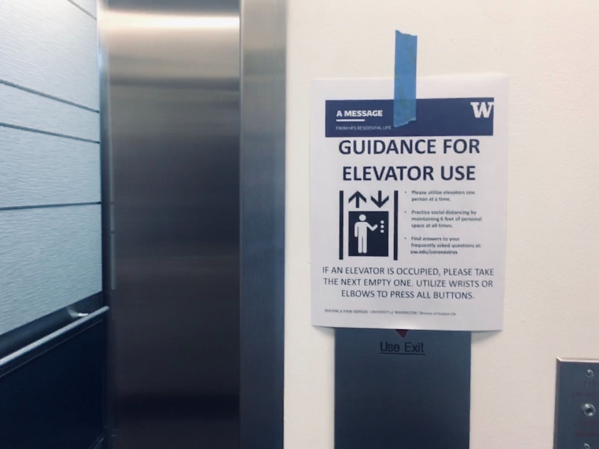 caption: Students and families are advised to take the elevator one at a time at Mercer Court at UW Seattle Campus. March 19, 2020.
