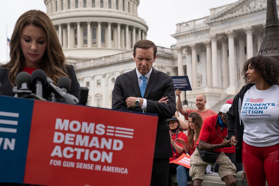 caption: Sen. Chris Murphy, D-Conn., center, and Shannon Watts, founder of Moms Demand Action, left, join activists and other Democrats to demand action on gun control. (J. Scott Applewhite/AP)