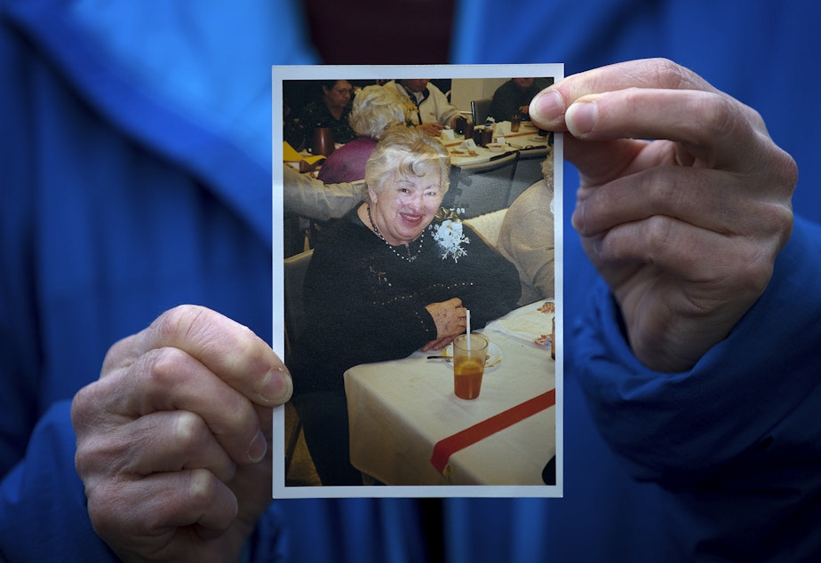 Pat Herrick holds a picture of her 89-year-old mother, Elaine Herrick, at the Life Care Center of Kirkland on Thursday, March 5, 2020, in Kirkland. Elaine Herrick had died early Thursday morning while in the care of Life Center amid a deadly COVID-19 outbreak. 