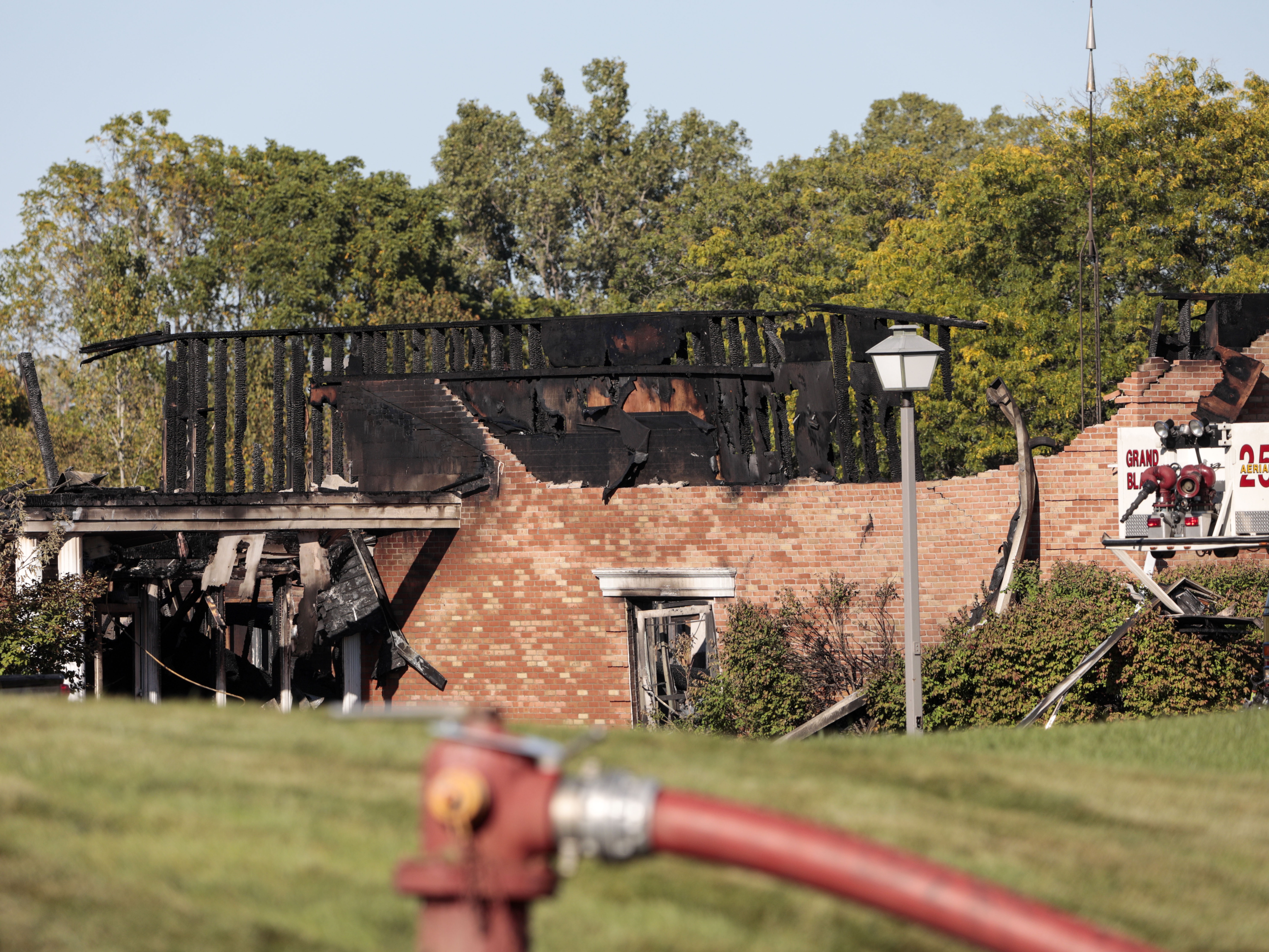 caption: Fire damage is seen at the Church of Jesus Christ of Latter-day Saints in Grand Blanc, Mich., on Sunday.