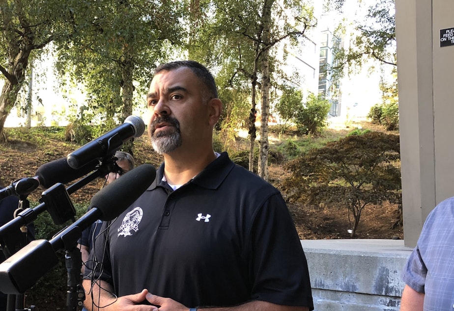 caption: King County Police Officers Guild President Mike Mansanarez says their latest contract includes a twenty percent pay raise over the next three years, which should help them hire more officers.  