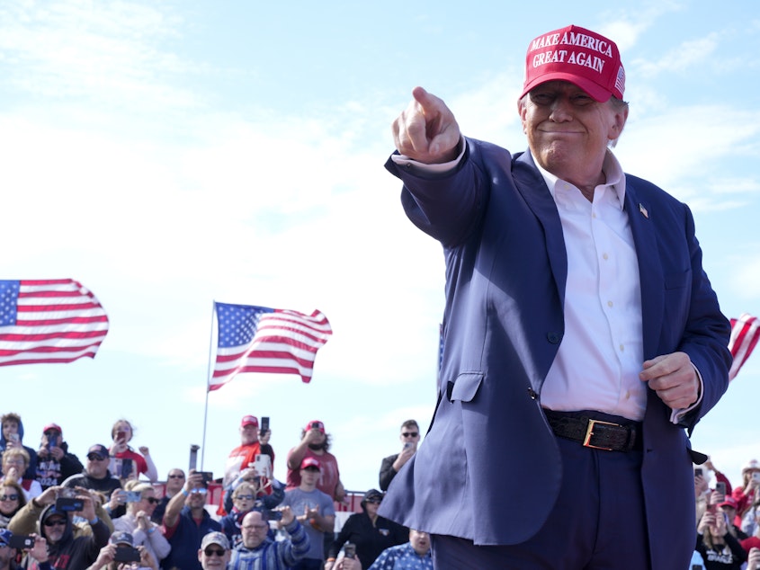 caption: Republican presidential candidate former President Donald Trump gestures to the crowd at a campaign rally Saturday, March 16, 2024, in Vandalia, Ohio.