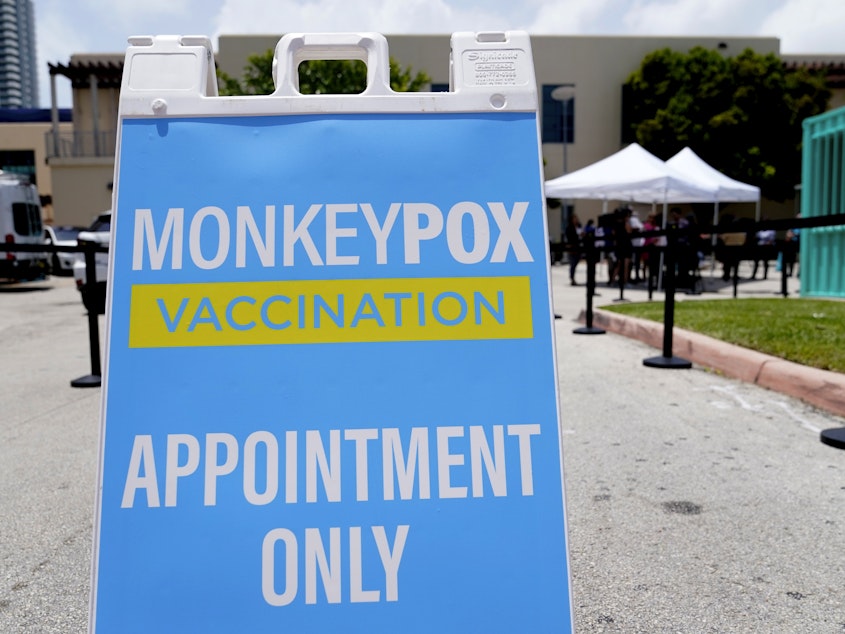 caption: A sign for monkeypox vaccinations is shown at a vaccination site in Miami Beach, Fla.