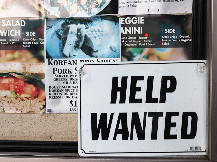 caption: The U.S. job market held up well in 2023, despite rising interest rates. Employers added 2.7 million jobs last year and unemployment remained under 4% throughout the year.