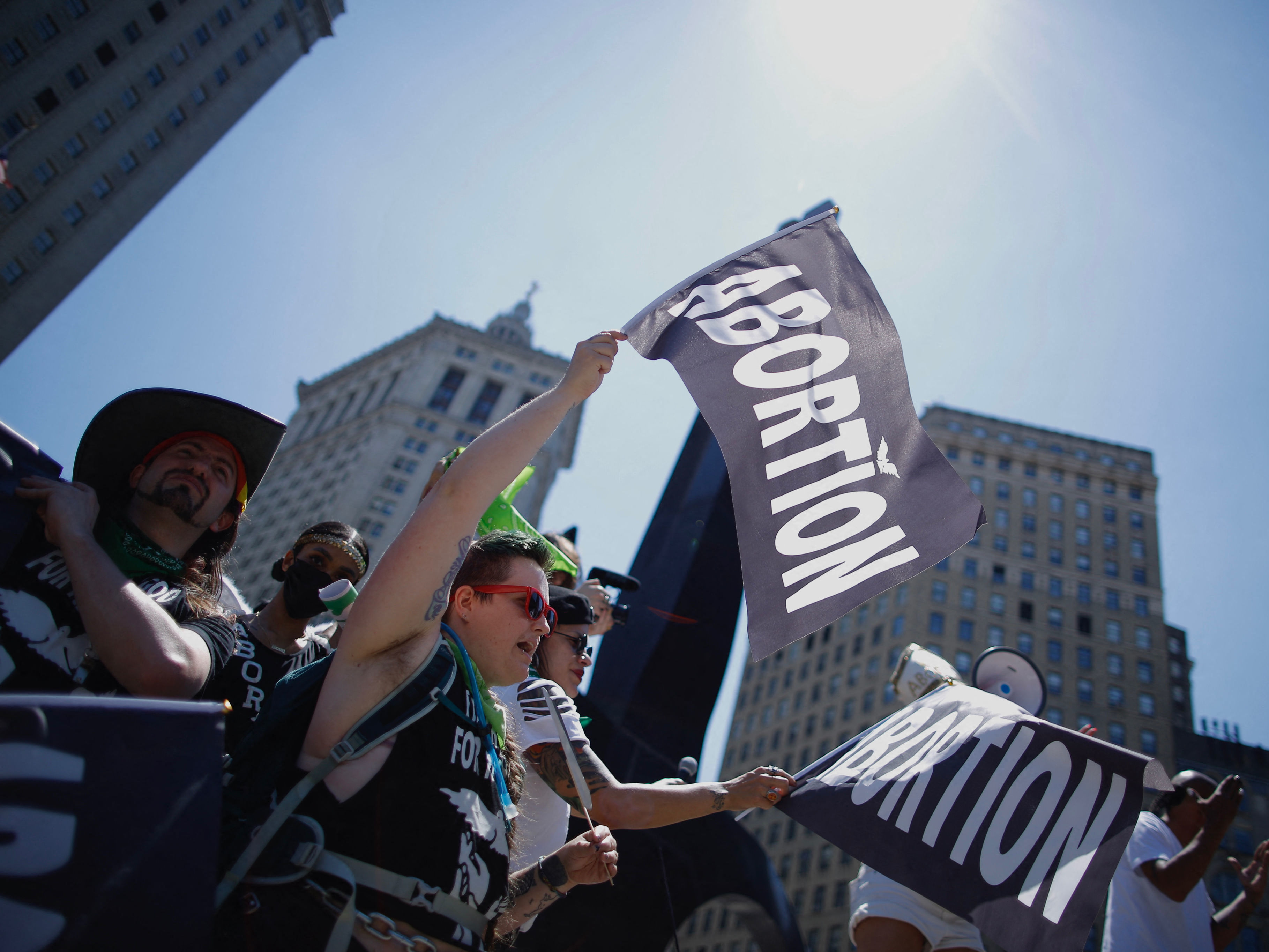 caption: Abortion-rights activists carry flags as they gather to participate in the Queer Liberation march in New York City earlier this week.