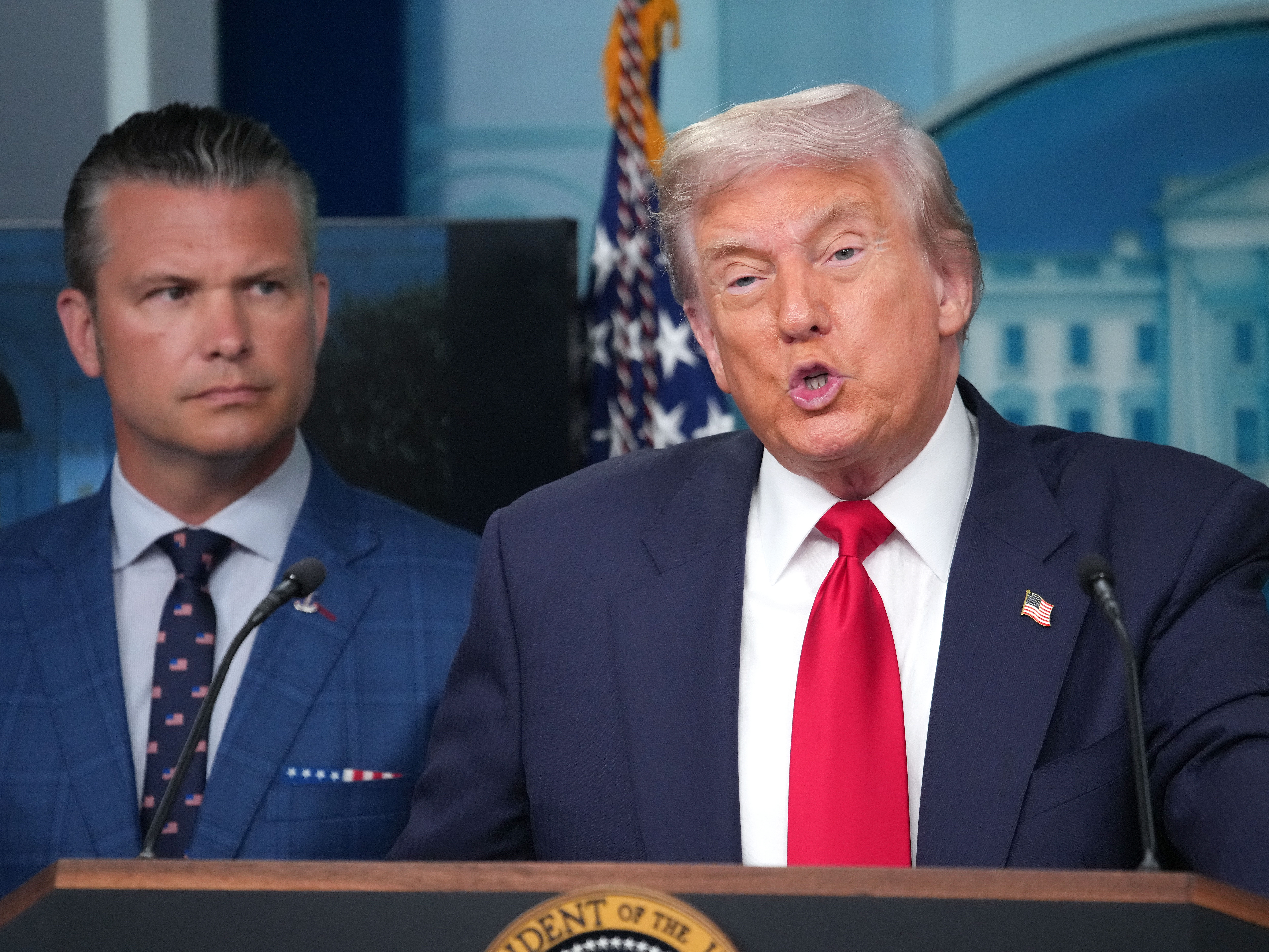 caption: President Donald Trump delivers remarks during a press conference at the White House along with Secretary of Defense Pete Hegseth.