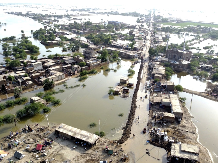 caption: Homes are surrounded by floodwaters in Sohbat Pur city of Jaffarabad, a district of Pakistan's southwestern Baluchistan province, Aug. 29, 2022. The U.N. weather agency predicts the phenomenon known as La Nina is poised to last through the end of this year — its third year in a row — and affect meteorological patterns like drought and flooding worldwide.