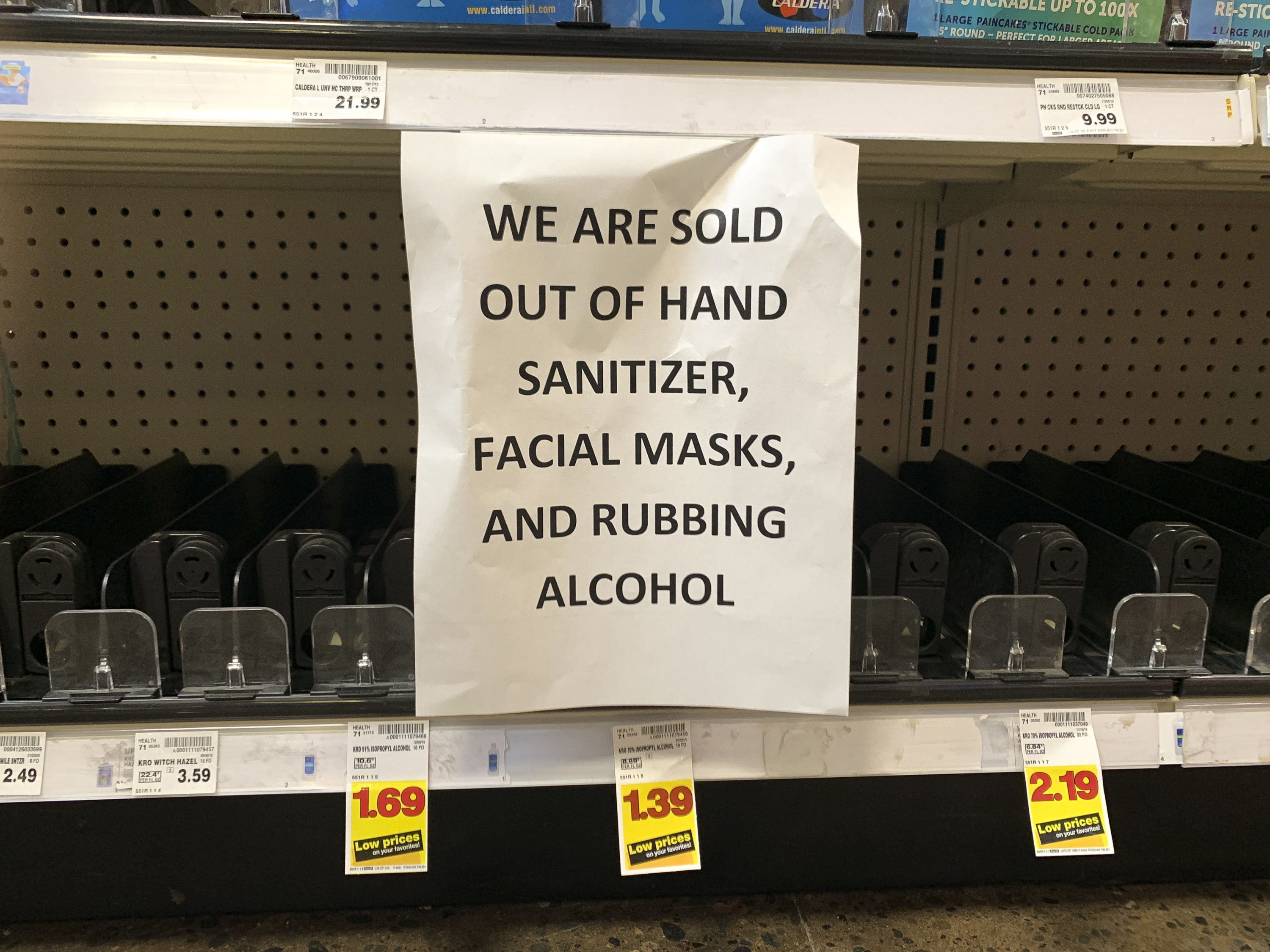caption: A sign advising out-of-stock sanitizer, facial masks and rubbing alcohol is seen at a store following warnings about COVID-19 in Kirkland, Washington on March 5, 2020. (JASON REDMOND/AFP via Getty Images)